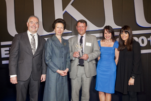 Johnstons of Elgin Managing Director James Dracup accepts the Gold Award from HRH Princess Anne. Left to right: Paul Alger, director of international affairs, UKFT; HRH The Princess Royal; James Dracup, Johnstons of Elgin; Carol Bagnald, HSBC sponsor of the Gold Award and Claudia Winkleman.