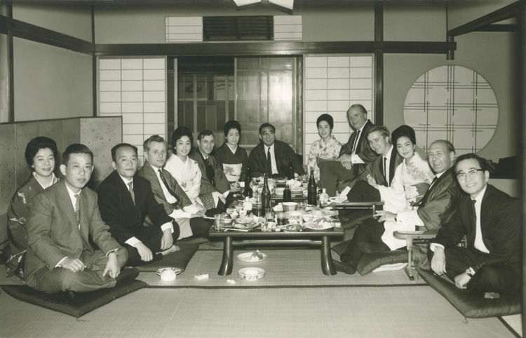 Karl Mayer (back right) with employees, agents and Japanese customer in the 60s