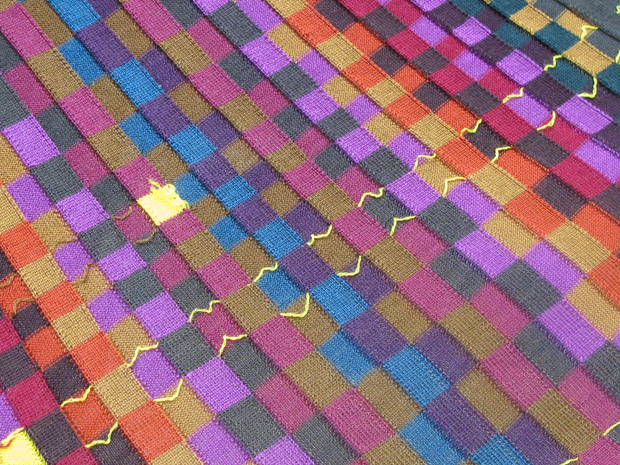 The multi-colour intarsia being knitted on the E12 ADF machine in Leicester showed the narrow field possibilities of the machine and the benefits of having independent feeder control. Much narrower colour fields are now possible for intarsia knitting on the ADF machine. 
