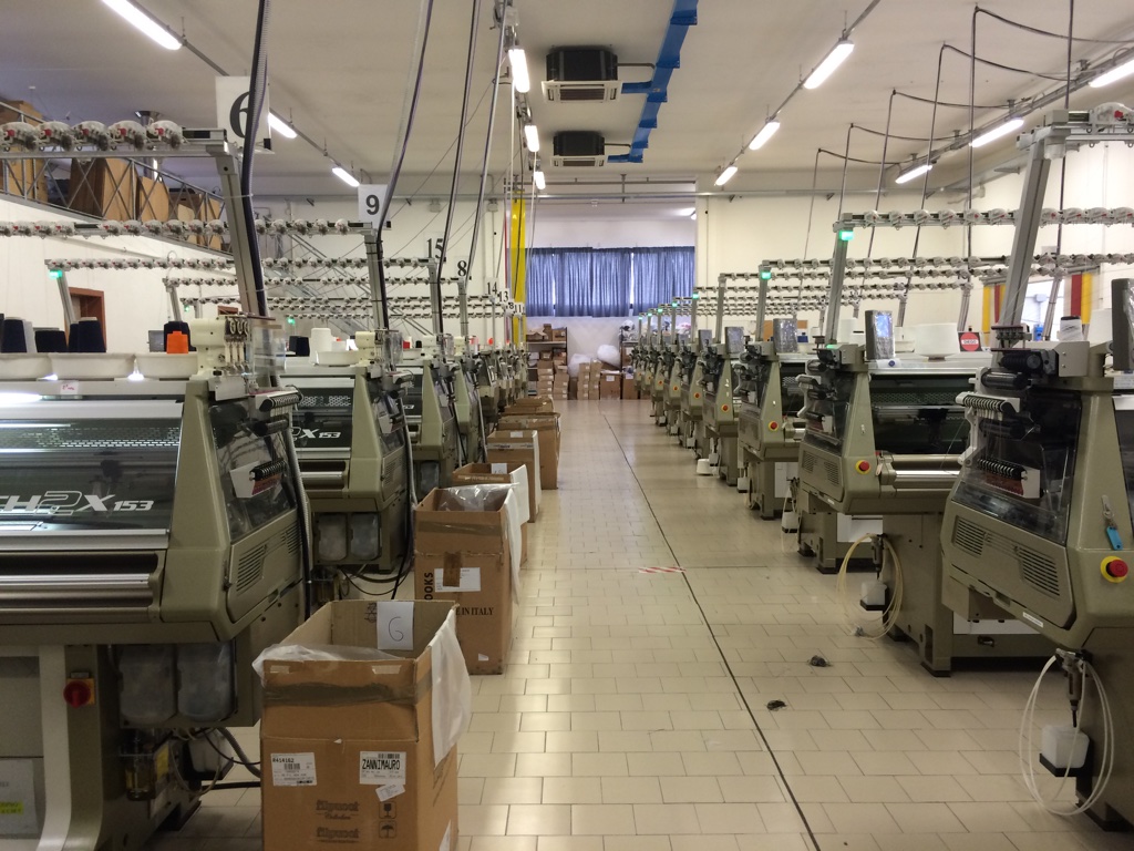 Shima Seiki MACH2X four needlebed WHOLEGARMENT knitting machines producing for Armani, Max Mara and Escada at Zanni Maglieria in Reggio Emilia.
