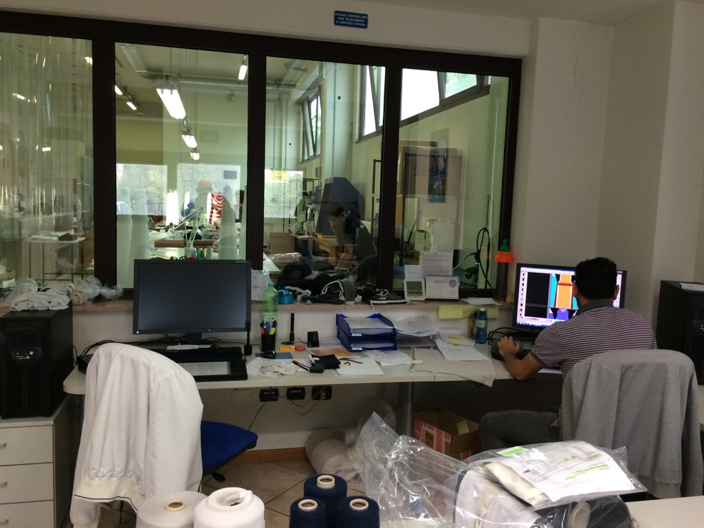 Shima Seiki SDS ONE APEX3 Design Systems in a busy sampling room at Zanni Maglieria.