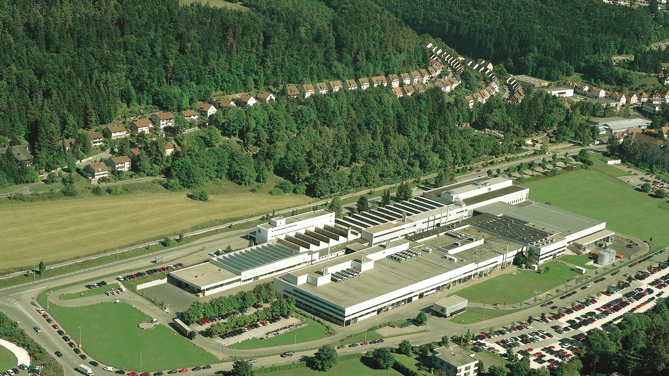 An aerial photo of the company’s headquarters ”“ the home of Mayer & Cie. for over a century. At present, around 330 people are employed here in production, development and administration.