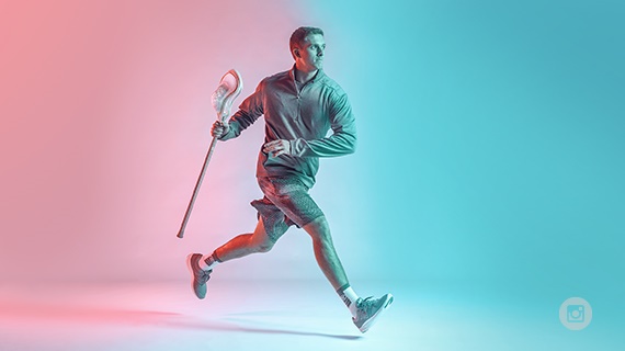 The Warp is a lacrosse stick incorporating an engineered flat knitted net knitted on a Stoll CMS flat knitting machine. © Warrior Sports/New Balance