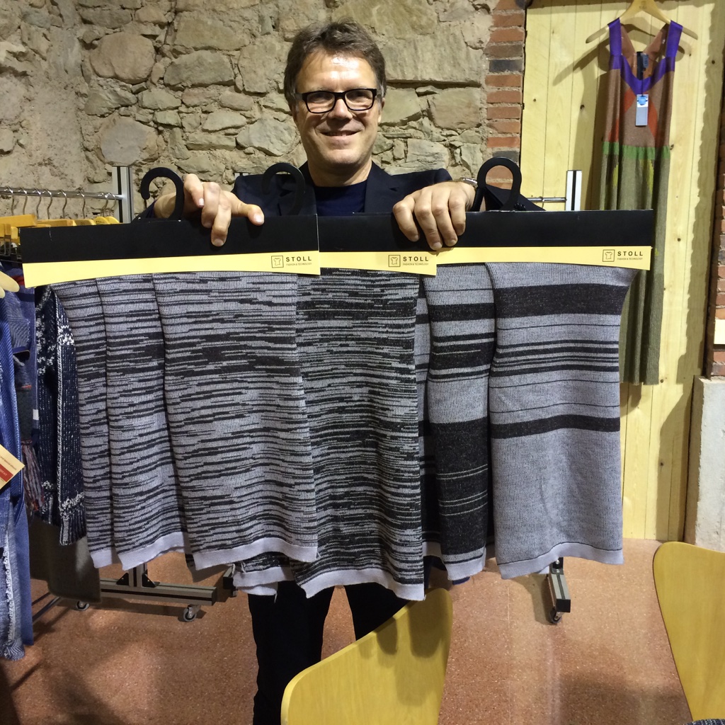 Joerg Hartmann, head of Fashion & Technology at Stoll with samples produced on the Stoll CMS ADF 32 BW. © Billy Hunter