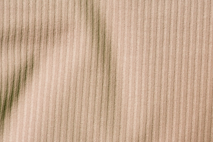 Fabrics with a ribbed construction on the surface and two-way stretch, produced on an RSE 5 EL in a gauge of E 28. © Karl Mayer 