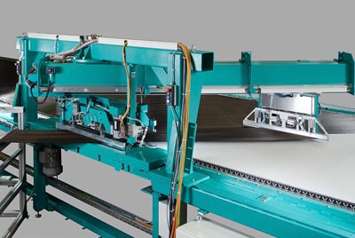 Laying module for processing spread carbon tapes from the flanged spool