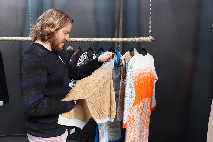 Jamie O’Neill discusses garment trims in fine detail in The Albion Knitting Company’s showroom.