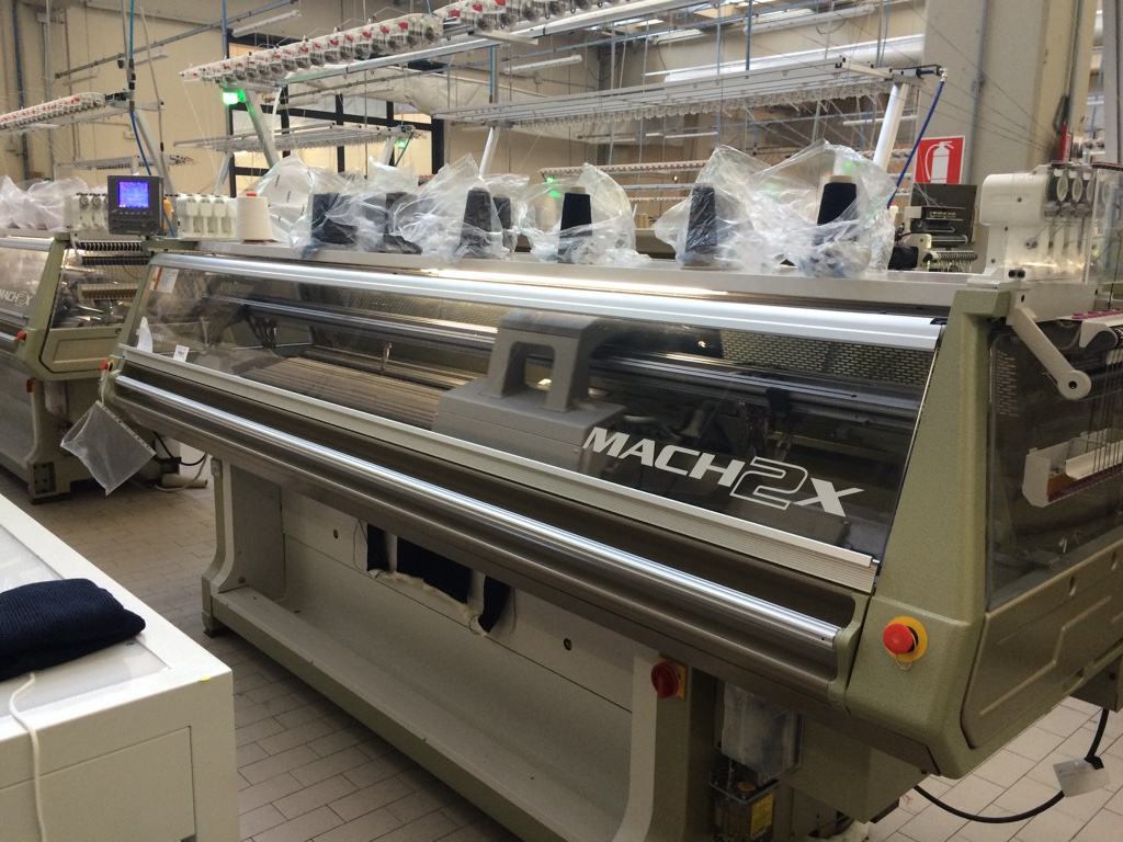 Shima Seiki MACH2X WHOLEGARMENT four needlebed machines in action at Lunigiane.