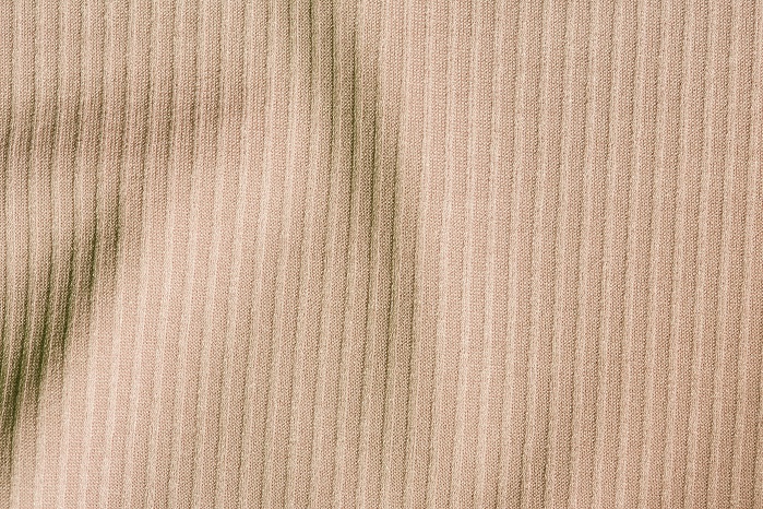 Fabrics with a ribbed construction on the surface and two-way stretch, produced on an RSE 5 EL in a gauge of E 28. © Karl Mayer 