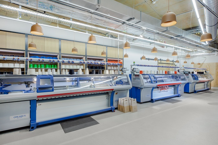 Shoppers could design a sweater and get it knitted by a state-of-the-art Stoll flat knitting machine within a couple of hours. © adidas  