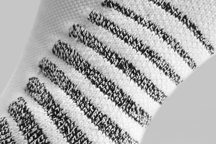   NikeGrip is achieved by twisting ultrafine polyester fibres with traditional fibres to increase the sock's surface area. © Nike 
