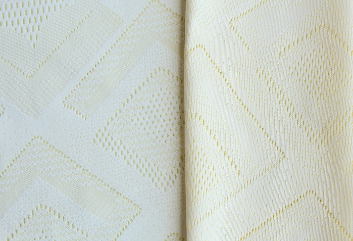 Fabric produced on the RSJ 4/1 ON with two-colour effects produced by specifically using different yarns in the ground and jacquard bars and with a cooling effect produced by processing functional Meryl Cool EcoDye on the inner and outer sides. © Karl Mayer