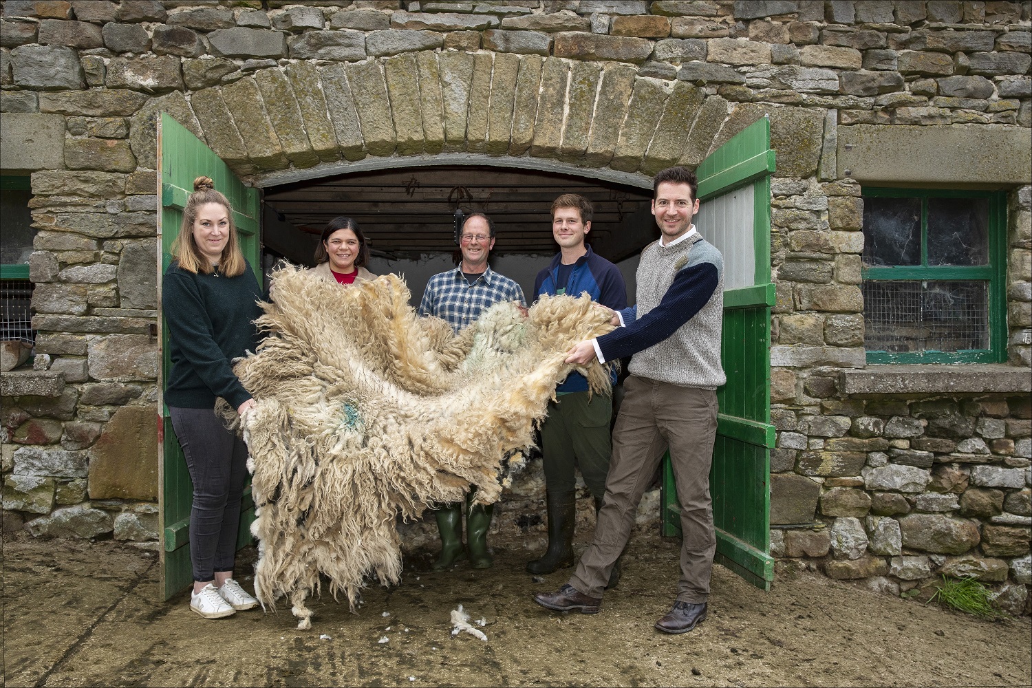 Farm to Yarn: (left to right) Zoe Fletcher and Maria Benjamin of The Flock, father and son farmers duo John and William Dawson with Edward Sexton, owner of clothing brand Glencroft. © Glencroft