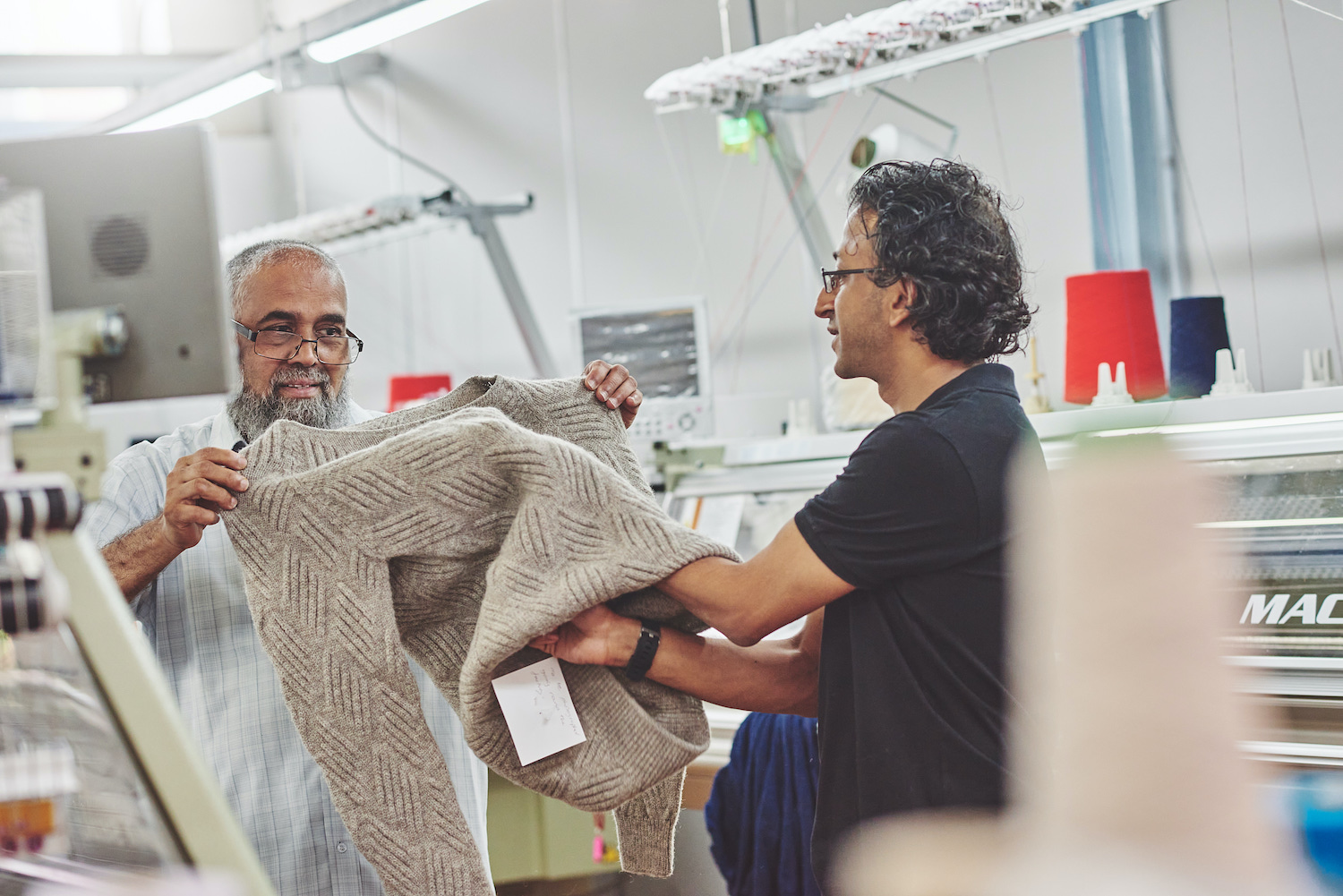 Snahal Patel, House of Sustainability’s founder and owner (right) inspects a seamfree garment. © House of Sustainability