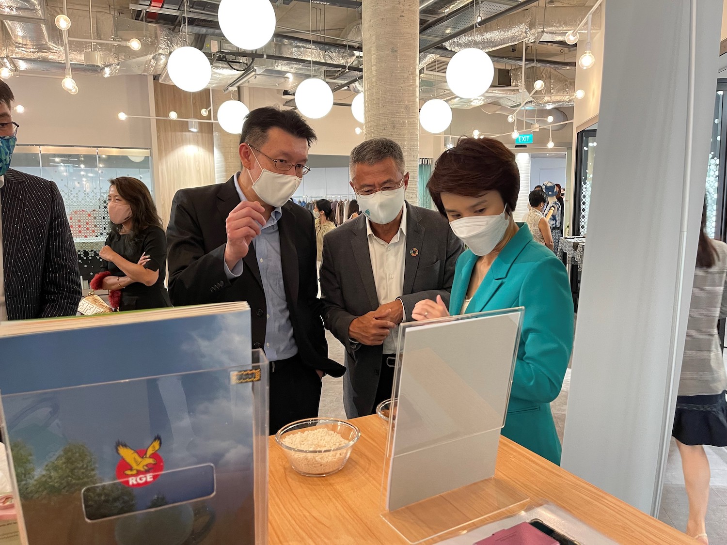 From Left to Right: Tey Wei Lin, RGE President, Bey Soo Khiang, RGE Vice-Chairman, and Low Yen Ling, Minister of State for Trade & Industry and Culture, Community, interacting with RGE's raw materials display at launch event. © RGE