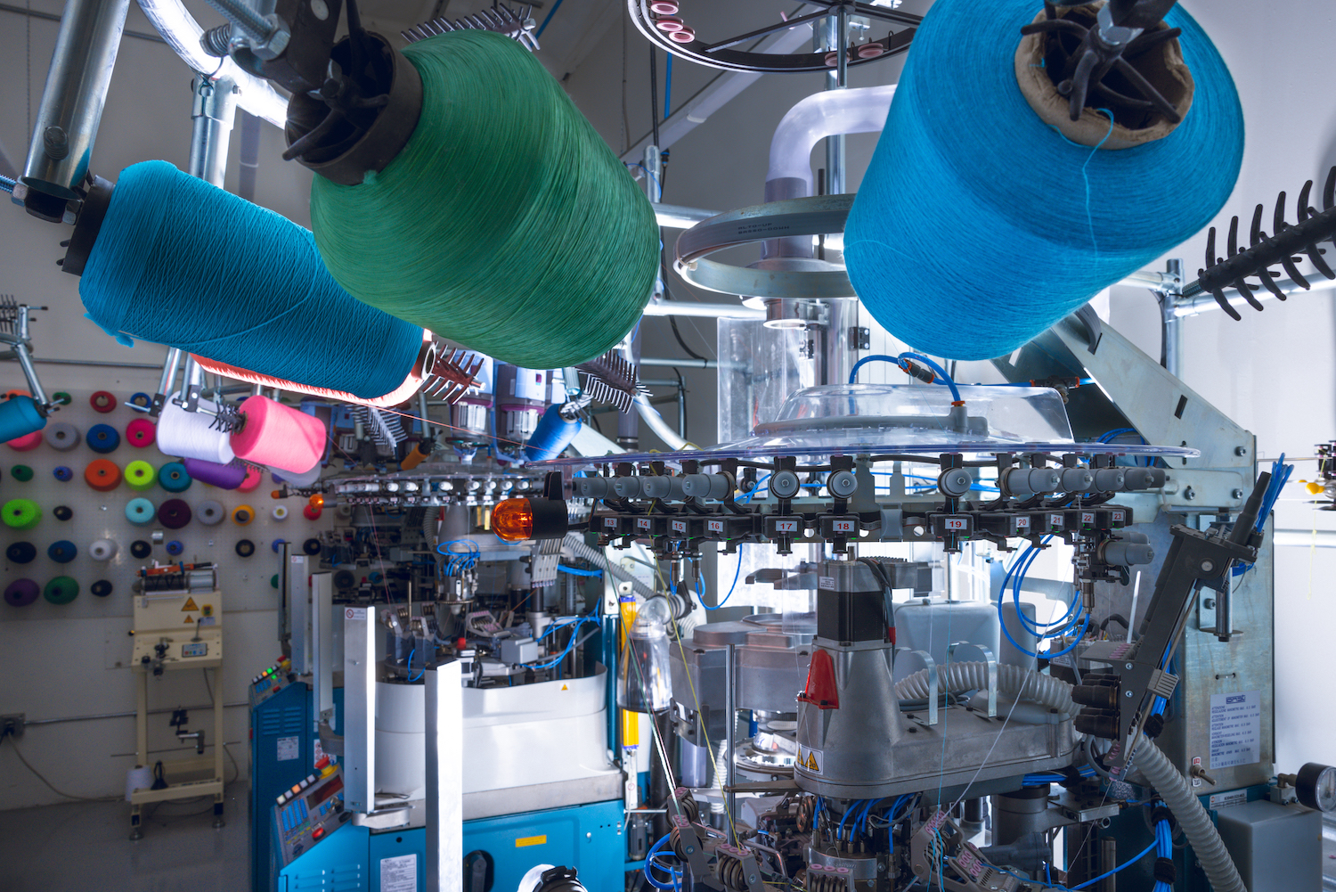 Knitting machines in action at the new factory in Oceanside, CA. © FutureStitch
