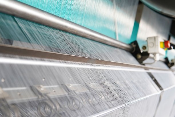 Warp knitting machine detail. © Karl Mayer Group