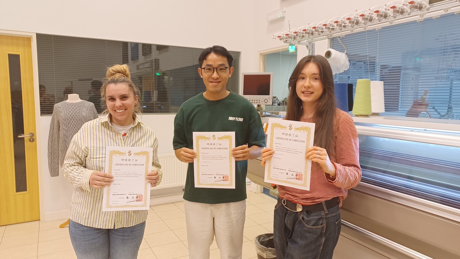 Runners-up, Anna Casalini, Derek Chan, and Isabella Hyland with their Shima Seiki Certificates of Completion. © Shima Seiki 